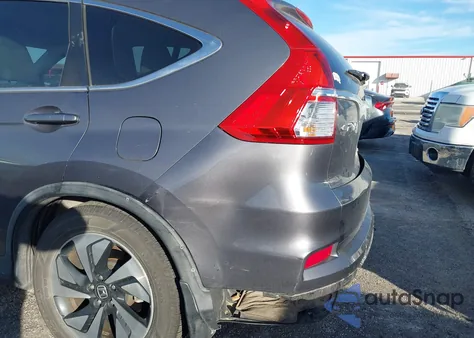 2015 Honda Cr-V Touring z USA, uszkodzony, nr VIN 5J6RM4H98FL129319